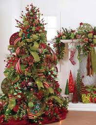 Loosely wrap wide, patterned ribbon around the entire tree in horizontal bands. Different Types Of Ribbon Throughout Pattern Mixed With Solid Christmas Decorations Pretty Christmas Trees Pretty Christmas