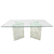 Looking to spruce up your dining area? Modern Glass Dining Table With Carrara Marble Bases Modern Glass Dining Table Glass Dining Table Dining Table Marble
