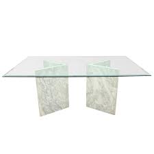 This furniture will be the centerpiece of a dining room where you entertain guests and share. Modern Glass Dining Table With Carrara Marble Bases Modern Glass Dining Table Glass Dining Table Dining Table Marble