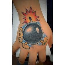 Although we can think that those who tattoo any type of bomb (from the classic round black bomb with a wick to an atomic bomb of. Michael Caamano Jr On Twitter Bombed His Hand With This Kind Of Bomb Thanks For Sitting Nice And Still Bombombtattoo Bombtattoo Supermariotattoo Videogametattoo Nintendotattoo Handtattoo Colortattoo Tattoo Custom Art Neotraditional