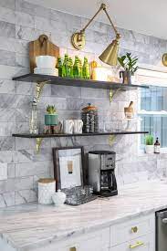 The shelves come in a stainless steel design and are perfectly suited for holding kitchenware and other important kitchen accessories. Dwell