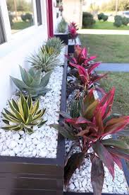 25 Modern And Chic Front Yard Design Ideas Digsdigs Be sure to use a mixture of textures and types including small yuccas or aloes.