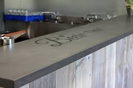 The surfboards are the very essence of surfing, in haunting a legendary haunting rifle or a set of antlers would have a similar relation for example. Concrete Bar Top Houzz