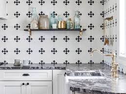 The backsplash design features the exact same shades of gray and white, giving this kitchen a fairly neutral look. 27 Unique Kitchen Backsplash Design Ideas