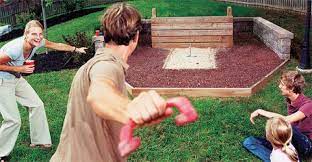The two side platforms are where a player stands to toss the horseshoes to the other pit. How To Build A Horseshoe Pit Bocce Ball And Volleyball Court
