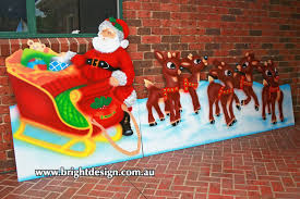 When displaying the reindeer and sleigh, position the reindeer directly in front of the sleigh and wrap lengths of ribbon around the necks of the reindeer. Bright Design Section 01 Santa Sleigh Outdoor Christmas Displays