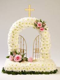 Gates Of Heaven Tribute With Chrysanthemums And Roses Available From Www Sussexfuneral Funeral Flower Arrangements Funeral Flowers Funeral Floral Arrangements