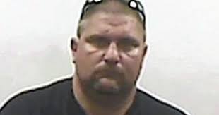 Warrant details arrest of ex-coach