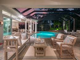 Outdoor Living Space Lanai Florida Backyard Design Covered Pool Pool Cage Screened Porch Neutral Outdo Outdoor Living Coastal Design Outdoor Living Space