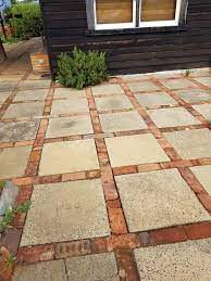 You have a world of options for backyard pavers, and perusing your options until you find the right brick paver projects are a great idea if you are looking for something fairly inexpensive and easy to acquire. This Is A Very Simple And Inexpensive Solution To A Patio Walkway Etc Cement Square Pavers Edged With Bricks S Reclaimed Brick Patio Backyard Patio Backyard
