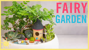 Better homes and gardens tv presenter tara dennis shows you how to create a magical fairy wonderland in your garden with tree houses and toadstools and how to create a fairy garden in miniature in a half wine barrel or pot using figurines. Diy How To Make A Fairy Garden Youtube