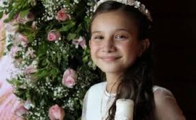 Denise Ruby García Padilla contenta en la misa en su honor