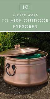 These 10 Clever Ways To Hide Outdoor Eyesores Can Keep All Your Gardening Tools And Yard Supplies Out Of Sight Garden Hose Storage Hose Storage Hidden Garden