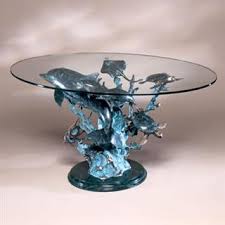 Usually bought in pairs, they accent the style of the coffee table or other furniture. Dolphin Seaworld Coffee Table