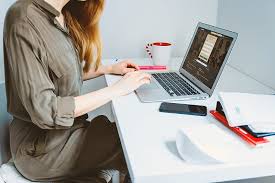 Medium shot of businesswoman working on digital tablet at home. Woman Looking For A Job Online On Laptop At Home Office Pikrepo