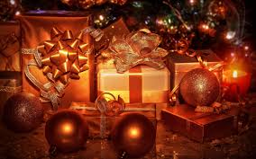 Want to spread some yuletide cheer? Christmas Gifts Decorations Balls Ribbon Golden Color Wallpaper Christmas Wallpaper Better