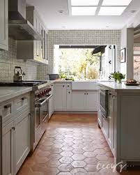 The hardness that makes tile so desirable as a kitchen floor surface can also be a drawback. Kitchen With Terracotta Hex Tile Floor Cottage Kitchen
