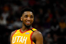 He played college basketball for the louisville cardinals. Donovan Mitchell Afroballers
