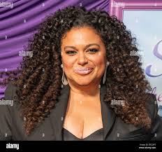 Michelle Buteau wearing dress by Keia Bounds attends New York premiere of  Netflix's "Survival Of The Thickest" at Metrograph