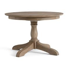 Raised upon typical regency style fluted swept legs with brass claw castors. Owen Round Pedestal Extending Dining Table Pottery Barn