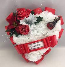 With exquisite artificial flower arrangements in shades of white, pink and red, floral bouquets our wide selection of artificial plants, flowers and coordinating vases at next provides long lasting beauty to your garden and home. Artificial Christmas Wreath Robin Silk Flowers Heart Memorial Grave Red Roses