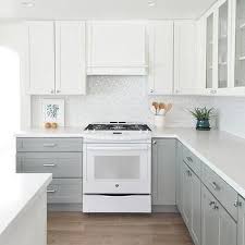 Two Tone Kitchen With White Upper Cabinets And Gray Lower Cabinets Transitional Kitchen Cabinets Grey And White Kitchen Cabinet Design New Kitchen Cabinets