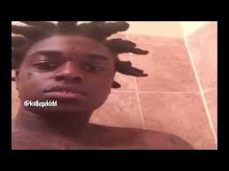 Two cross tattoos on side rib of a man. Kodak Black Gets Cross Tattoo On His Forehead Youtube