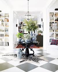 Round Table In Large Entryway Foyer With Black And White Checkerboard Floor Home Interior Foyer Decorating