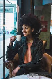 Check out our black hair bangs selection for the very best in unique or custom, handmade pieces from our hair care shops. Black Woman With Afro Hair Drinking A Coffee In A Coffee Shop Girl African American Stock Photo 245925006