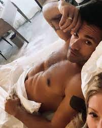 Kelly Ripa Shares Photo of Husband Mark Consuelos Shirtless in Bed