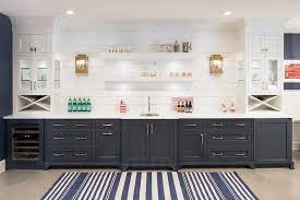 We will be painting all the trim and doors in our house this color. Dark Blue Basement Wet Bar Cabinets With White Shiplap Backsplash Trim Cottage Kitchen