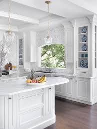 White is one of the best colors for making a room feel open and bright. Luxury Traditional White Kitchen Crystal Cabinets