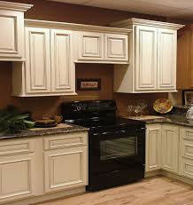 kitchen white cabinets brown walls