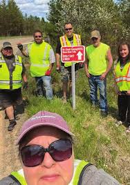 Employees Post Signs Directing Trail Riders to Ho-Chunk Gaming and Hotel