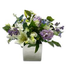 Visit our showroom for inspiration or our website to. Arrangement Of Pretty Purple Blue And White Flowers In Square Mirrored Vase We Are Not A Shop