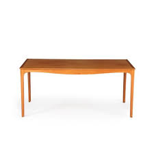 Beautiful, mahogany coffee table by josef frank, with the rounded square table top standing on pawed legs. Ole Wanscher Coffee Table Of Mahogany With Curved Rail Mutualart