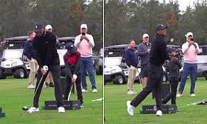 Tiger woods was conscious and talking after the crash, the authorities said. Tiger Woods And His 11 Year Old Son Charlie Show Off Stunningly Synchronised Shots On Driving Range Daily Mail Online