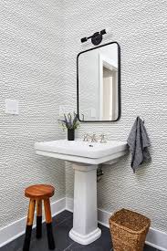 Sophisticated powder room ideas can be easy and inexpensive. Modern Powder Room Features Black And White Wallpaper A Pedestal Sink And A Modern Mirror Hgtv