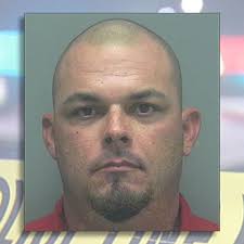 Florida man charged with slugging softball umpire