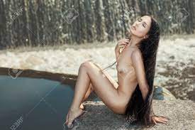 Nude Girl With Long Hair Sitting Near A Waterfall Stock Photo, Picture and  Royalty Free Image. Image 35413222.