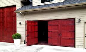 Affordable, strong, warm, unlimited custom designs. Bifold Wooden Garage Doors Diy Garage Door Garage Doors Folding Garage Doors