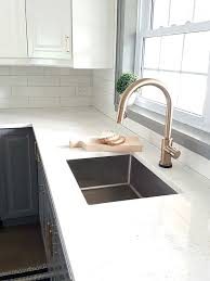 a gold kitchen faucet by delta