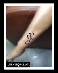 M Initial With Heart Tattoo On Wrist Colourful Tattoo Name Tattoo Alphabet Tattoo Black Work Tattoo Heart Tattoo Wrist Name Tattoos On Wrist Heart Tattoo