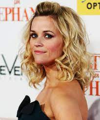 The hair has straight hair that is falling freely from the top. Reese Witherspoon Hair Makeup Through The Years