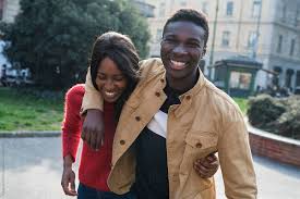 Having a garage is an excellent addition to your house, especially if you own a vehicle. Young Couple Having Fun Together In The City By Garage Island Crew Fun Happy Stocksy United