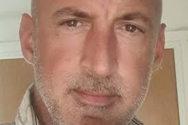 Drunk driver tried to get a drink from car during arrest