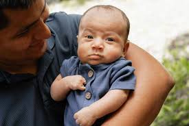 This is our sweet little guy, Elias. He's seven weeks old and was born with  a right hand limb difference (no middle finger, webbed “nubs” for the other  fingers). We had no