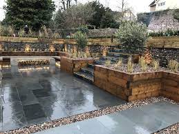 Beautiful Multi Level Garden By Tranquilo Landscapes In Bristol U K Polished Concrete Fire Pit Wit Landscaping Retaining Walls Retaining Wall Concrete Patio