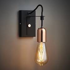 Specifically designed to add ambient lighting in a variety of spaces, more of today's wall sconces and wall lamps are specifically shaped to add dramatic up and downlighting effects, really adding depth and structure to a room. Detroit Black Copper Effect Wall Light Diy At B Q