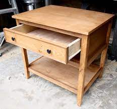 Attach the bottom drawer first, using the bottom of the nightstand as a guide, then attach the top drawer. Diy Bedside Table With Drawer And Shelf Free Plans